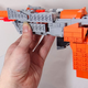 Image for article titled The NES Zapper Becomes a Transformer. A Bright, Orange Megatron.